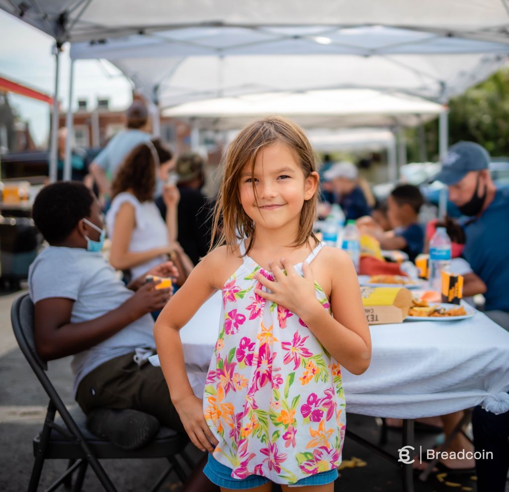 Girl welcoming people at a flash table event Girl welcoming people at a flash table event.