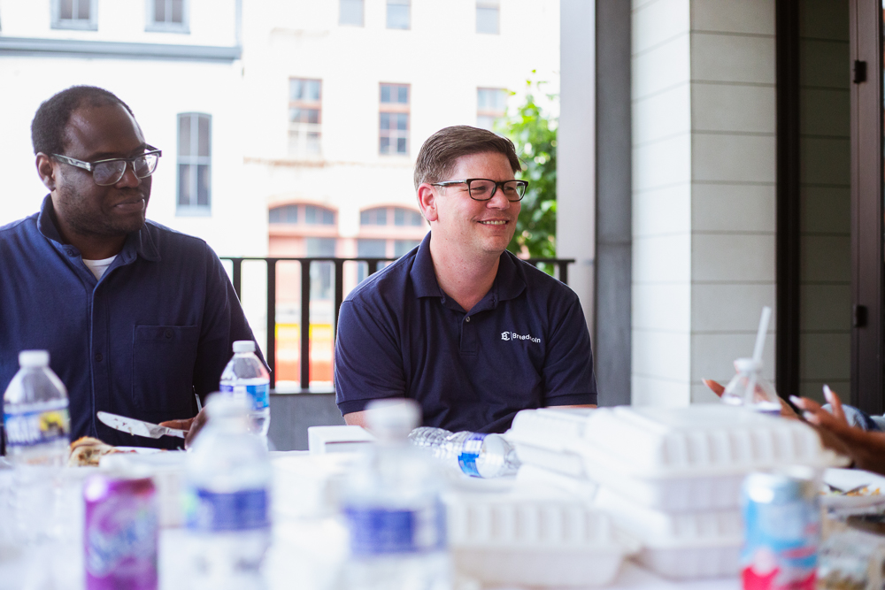 Photo of Breadcoin team members at a shared table in Baltimore